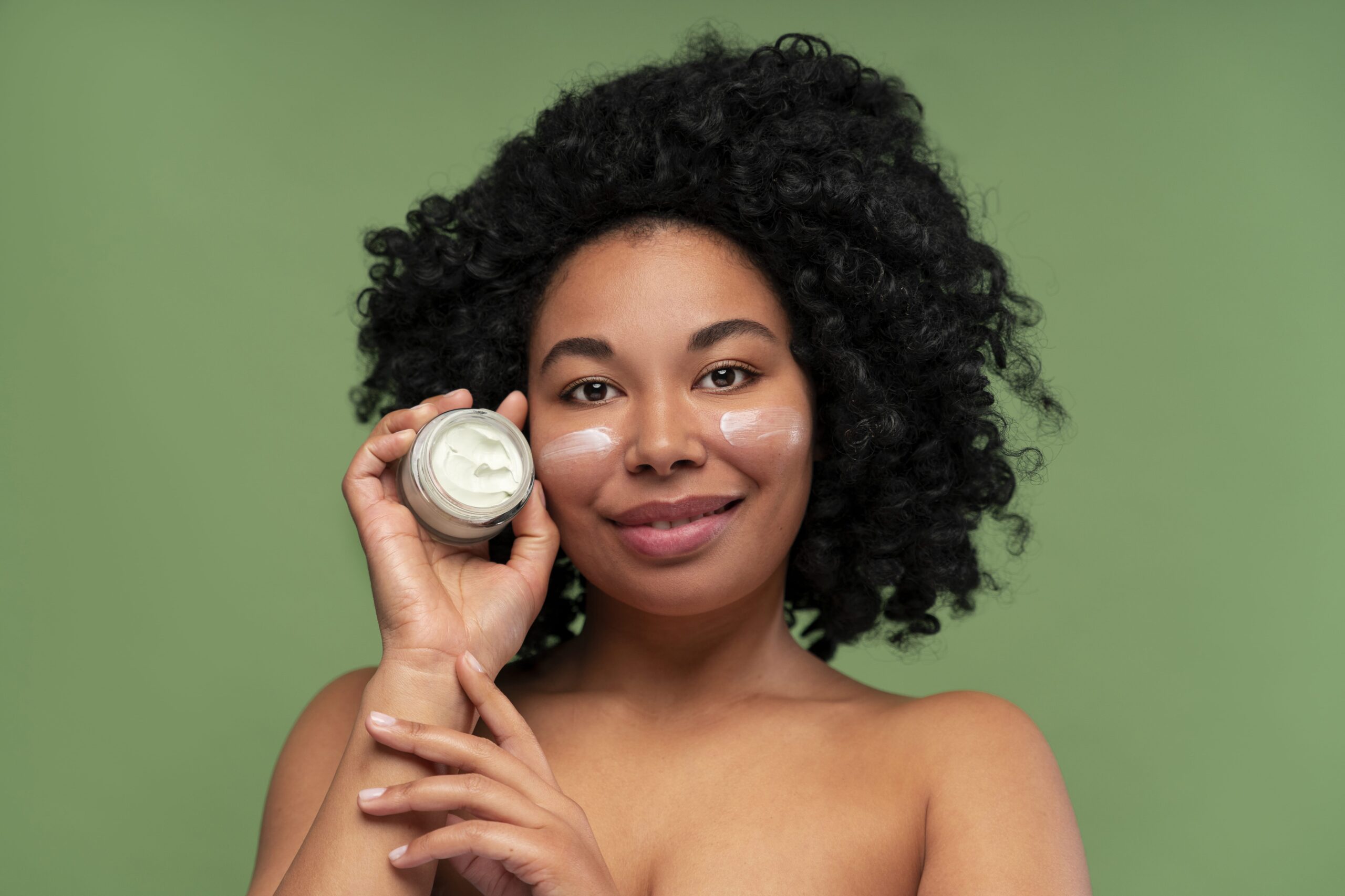 portrait-young-beautiful-woman-with-moisturizing-cream-min